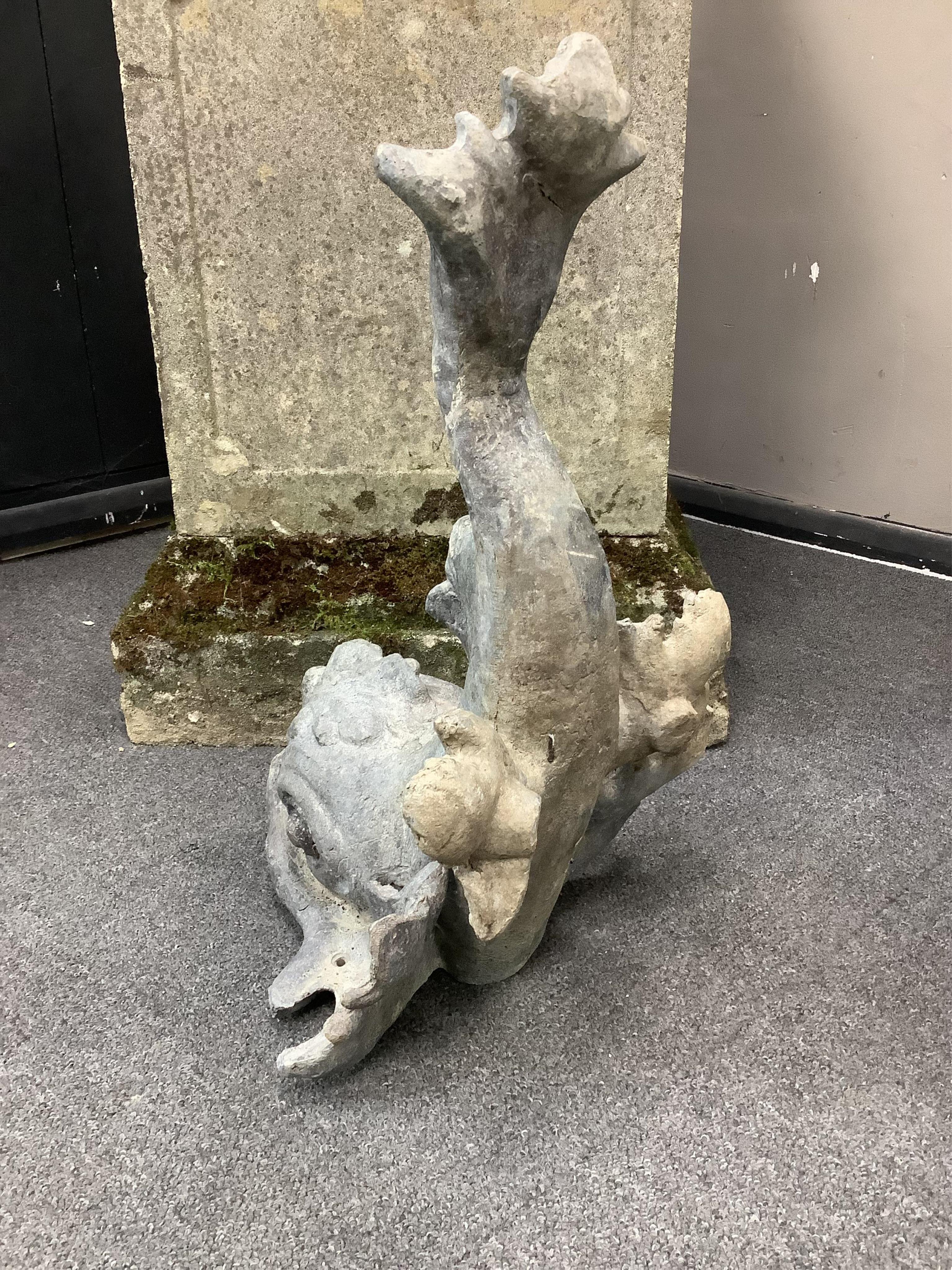 A 19th century lead dolphin fountain head, height 48cm. Condition - fair